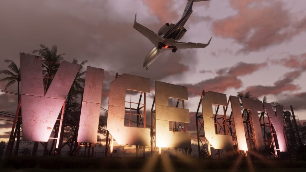 The Vice City sign at dusk with a plane flying over it