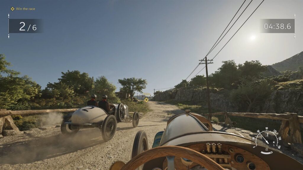 A first person view of a race in turn of the century cars, a lap counter on screen