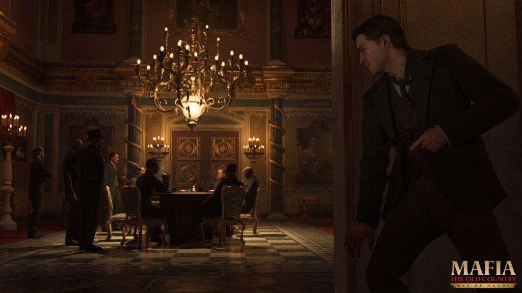 A grand hall with a chandelier, men seated at a table, a figure walking past