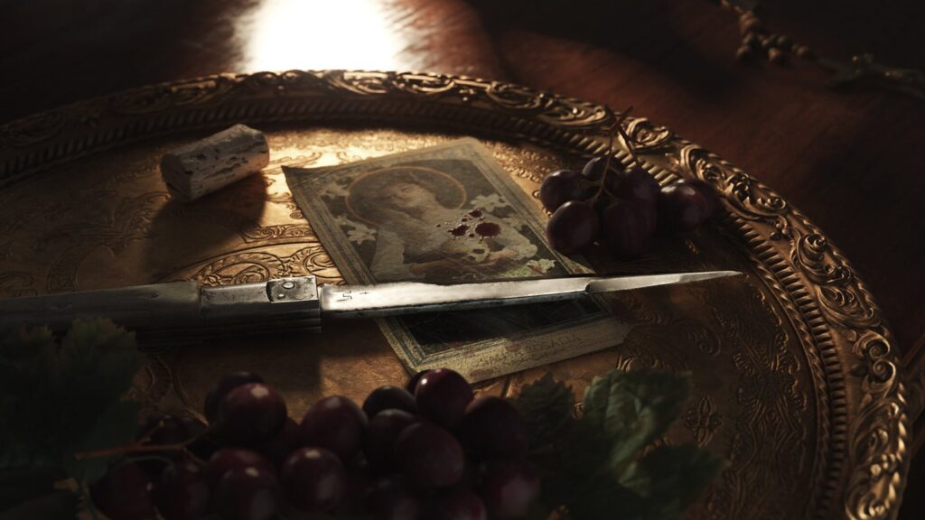 A knife, an old photograph and banknotes on a tray beside grapes