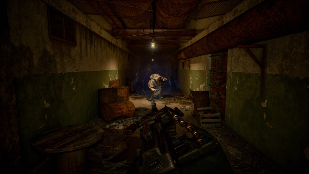 A hooded mutant surrounded by blue psi energy in an underground corridor