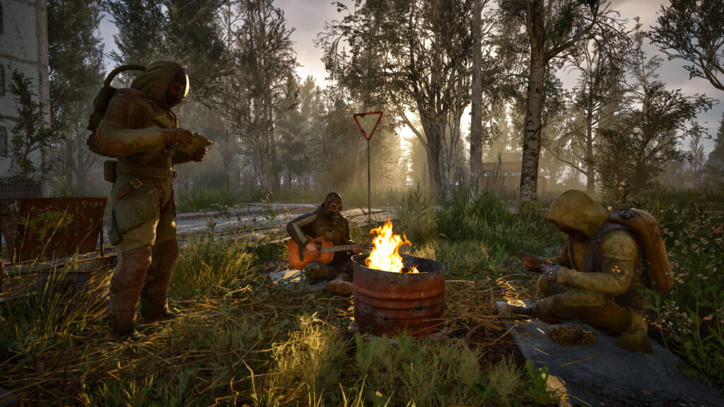 Stalkers resting around a campfire, one of them playing guitar