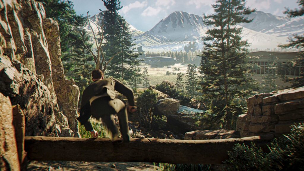 Bond taking cover by a fallen tree in a forest