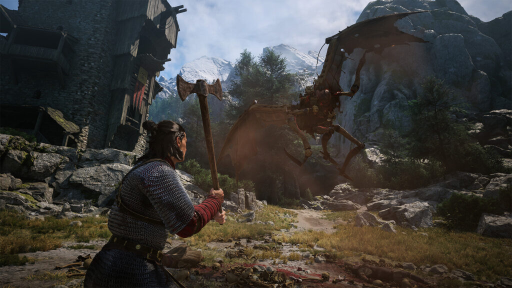 Coen with an axe facing a winged monster