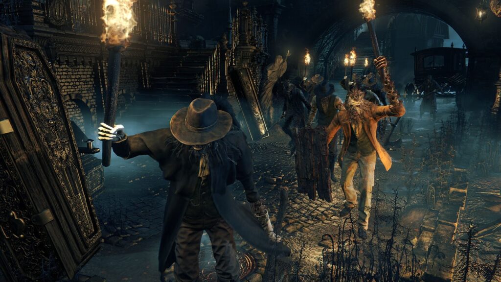 Een menigte met fakkels in Central Yharnam in Bloodborne