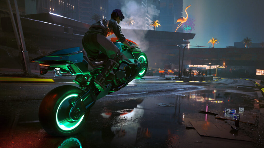 Een motor met neonwielen op een straat bij nacht in Cyberpunk 2077