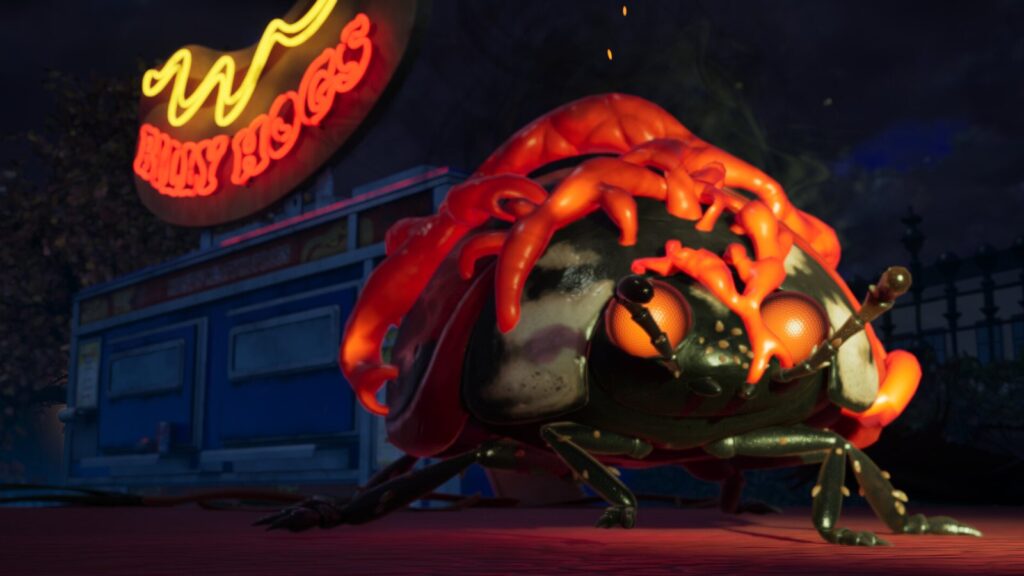 A giant ladybird beneath a neon sign