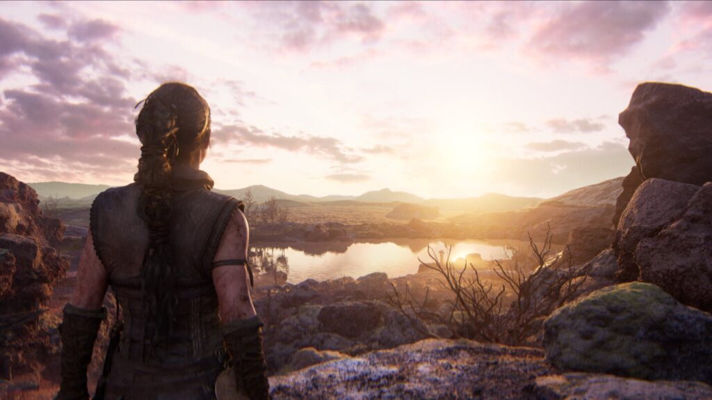 Senua on a clifftop at sunset