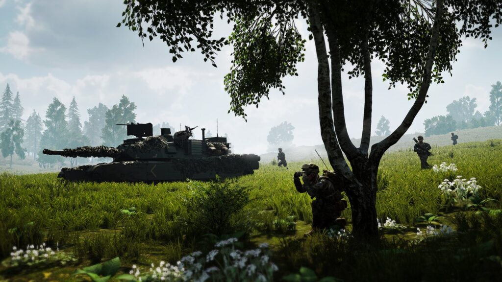 Een tank en infanterie in een weiland bij een bos