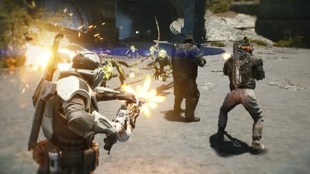Three armoured marines fire at a swarm of Aliens on a sandy open landing pad