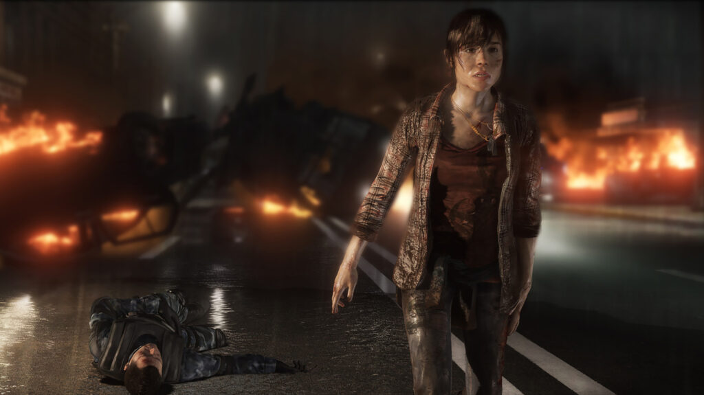 Jodie in een jas op een natte weg in de nacht, achter haar brandende wrakstukken, uit Beyond: Two Souls