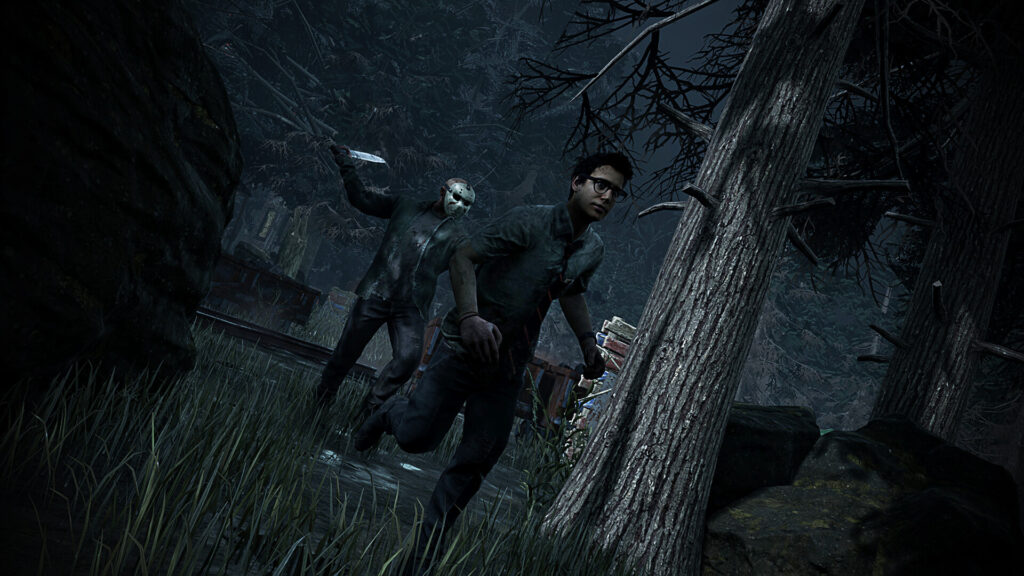 A survivor runs through a night forest with Jason following behind, machete in hand