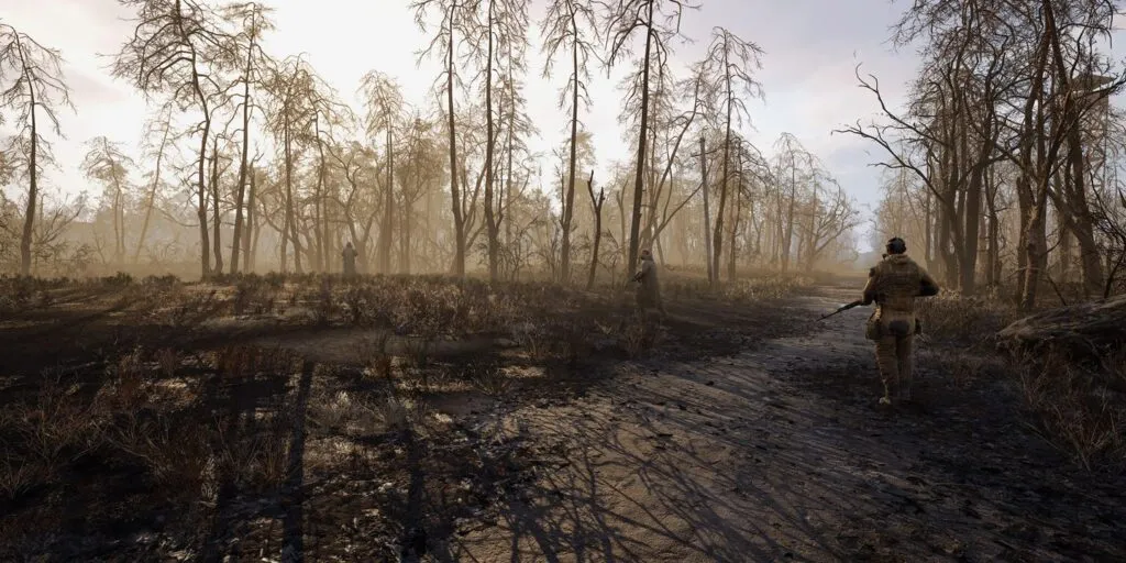 A stalker walking down a forest road in S.T.A.L.K.E.R. 2