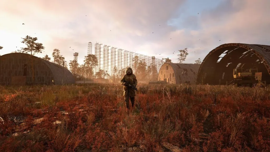 Hangars and a field at sunset in S.T.A.L.K.E.R. 2