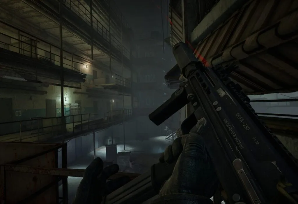 A weapon in hand inside an industrial building in S.T.A.L.K.E.R. 2
